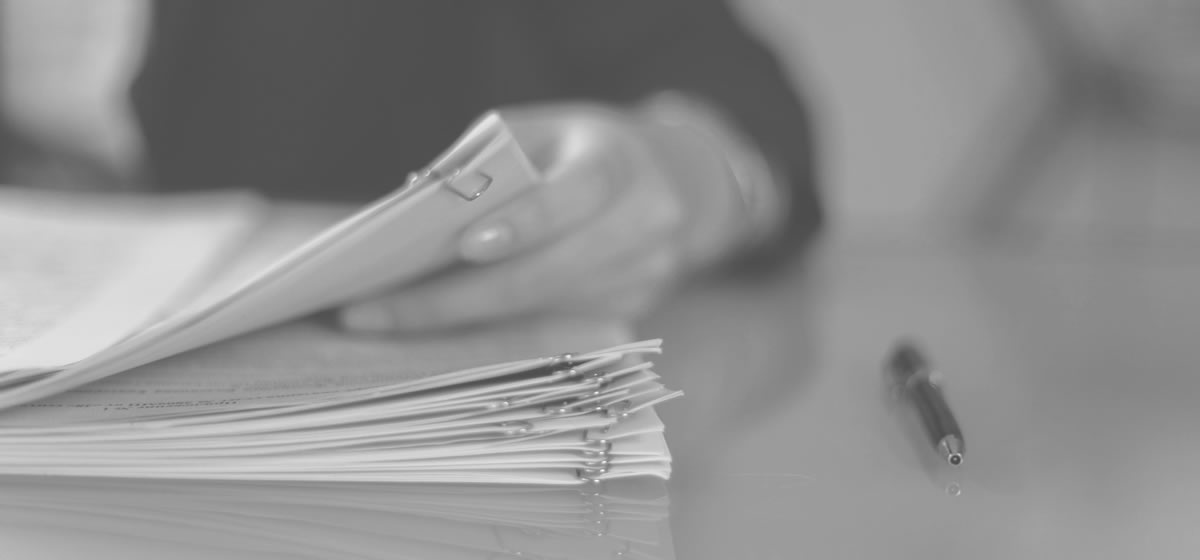 Restrained institutional image representing stacks of polygraph reports under review